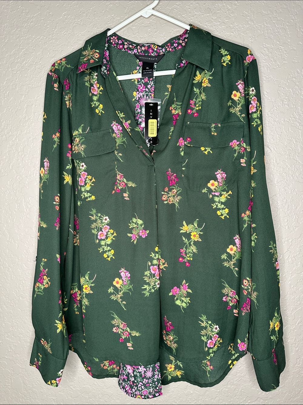 Investments mixed print green with pink floral blouse.